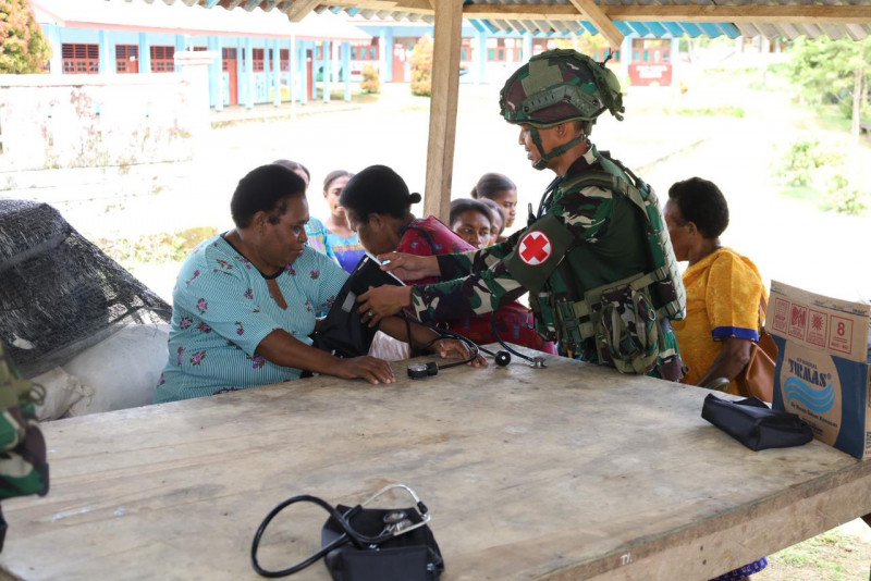 Awali Pengabdian Di Papua Barat Daya , Batalyon Infanteri 10 Marinir/SBY Laksanakan PAM Gereja Dan Bakti Sosial